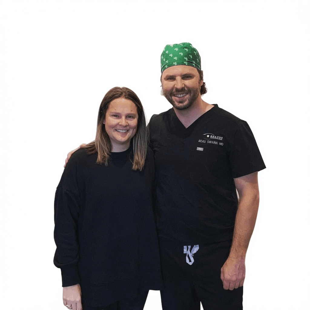 Dr. Beau Swann with a female LASIK patient in scrubs