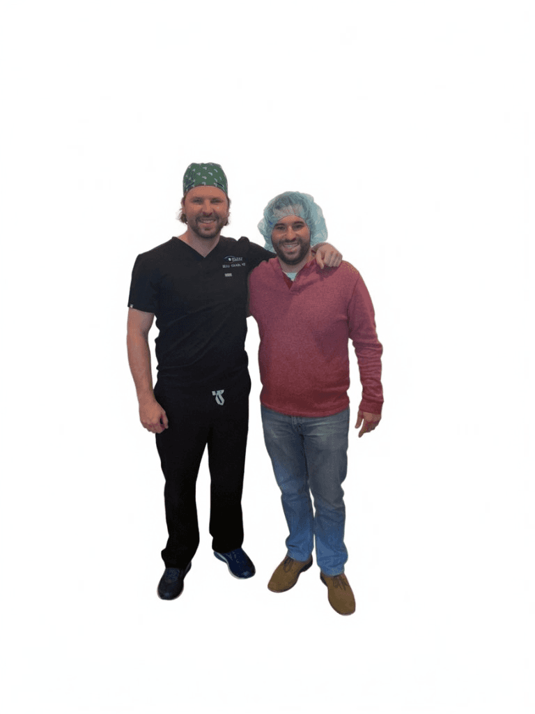 Dr. Beau Swann with a male LASIK patient in a surgical cap