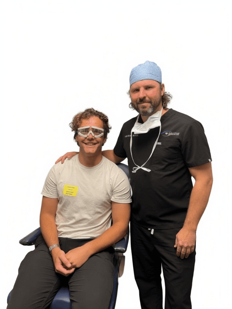 Dr. Beau Swann with a post-op LASIK patient wearing protective eye shields