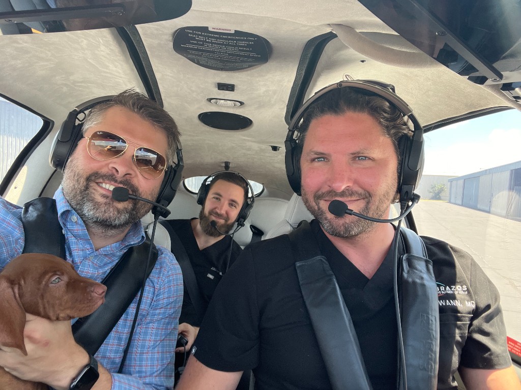 Brad and Dr. Beau Swann together in the cockpit — two brothers in their element